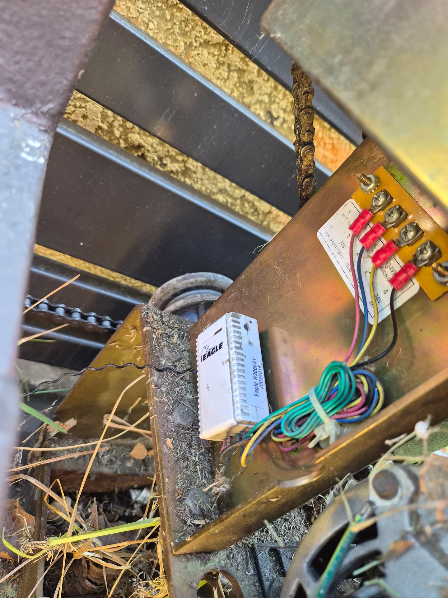 Gate operator wiring bay with an Eagle receiver and low-voltage wire terminations