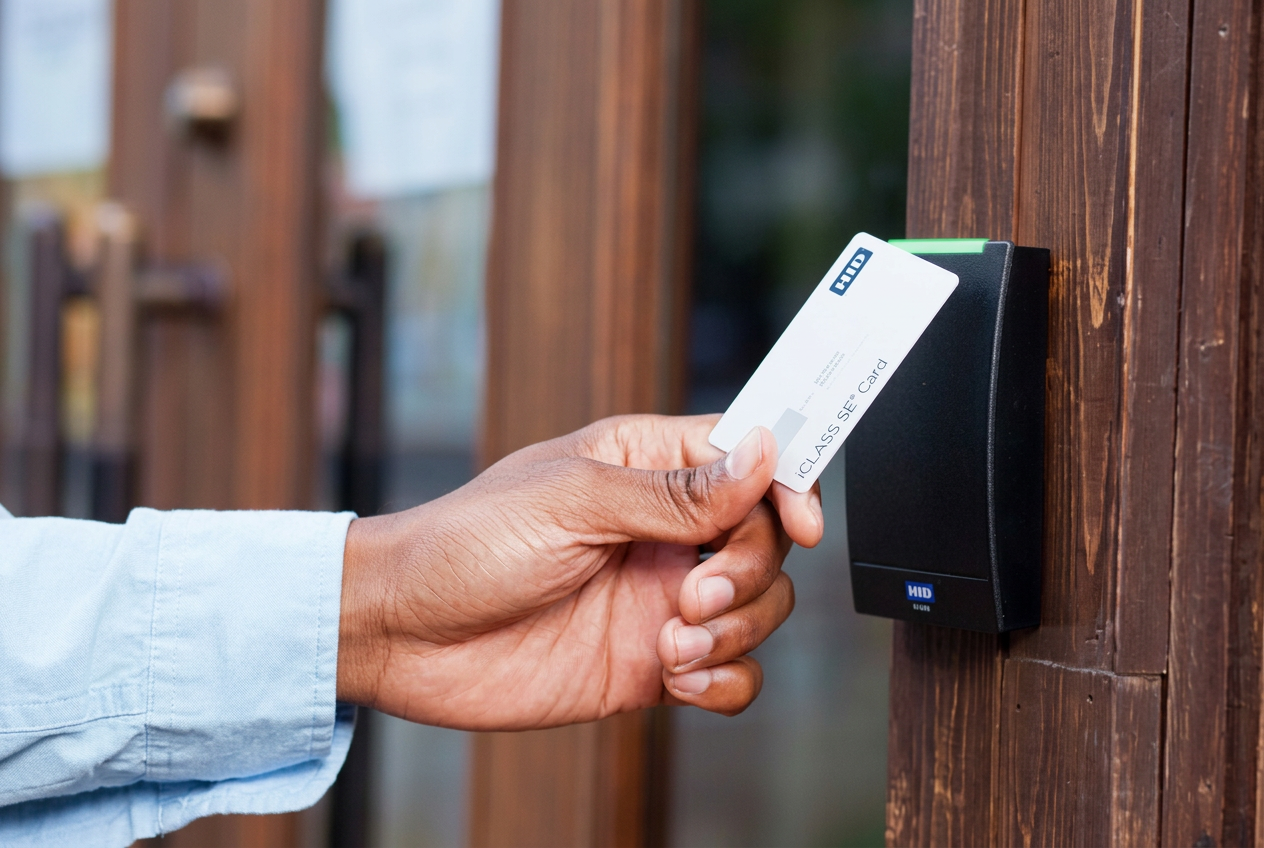 Access card presented to a card reader at a gated entry