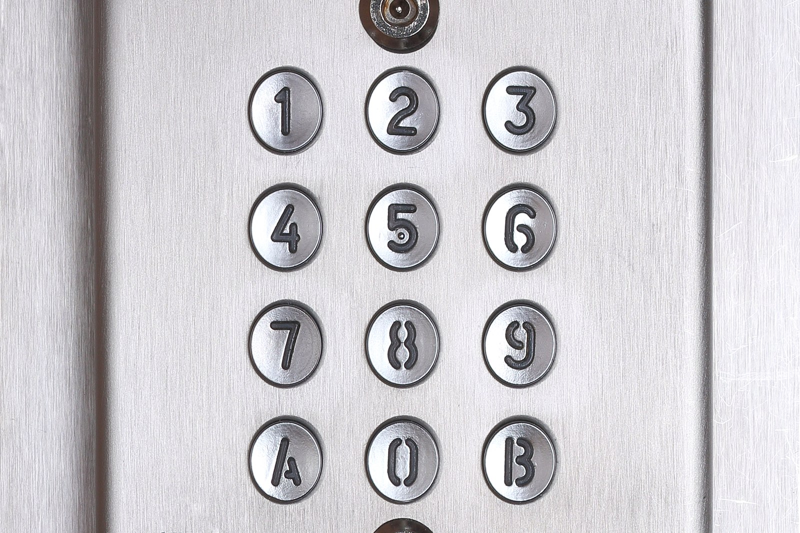 Weather-resistant metal keypad with coded entry buttons