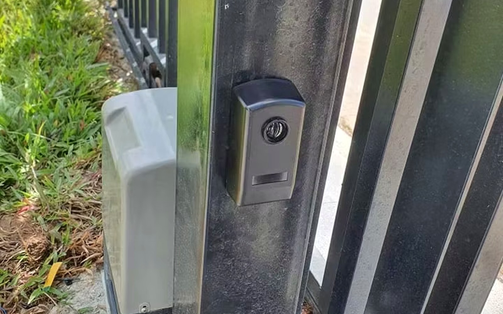 Automated gate opening with operator and beside-post safety devices installed