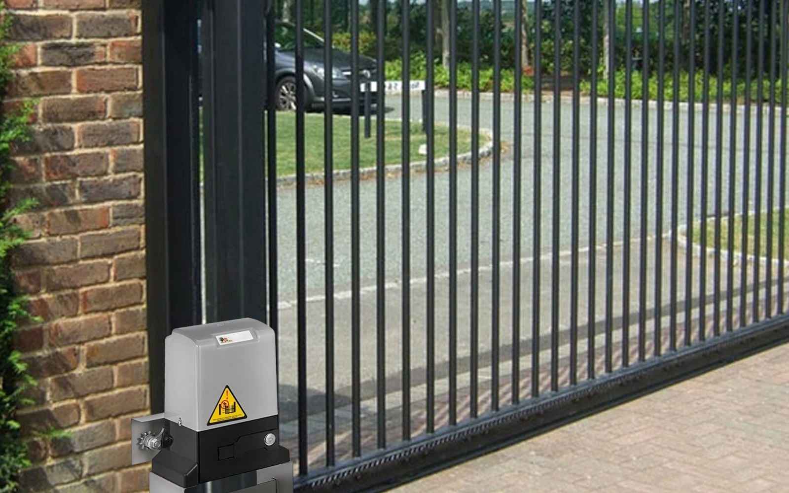 Gate operator power enclosure with conduit runs mounted on a concrete pad