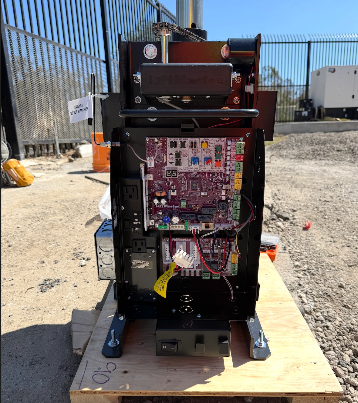 LiftMaster slide gate operator with its control board open, serviced on site
